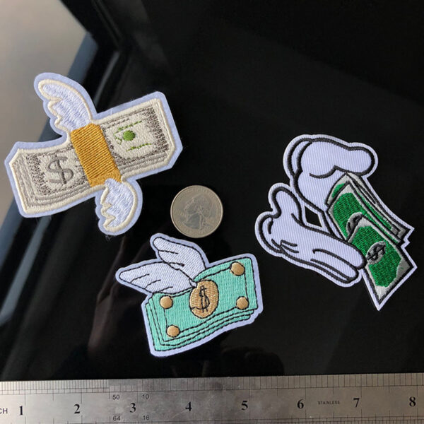Dollar iron on patches cartoon wings flying to attract wealth dollar counting both hands embroidery clothing embroidery stickers are.